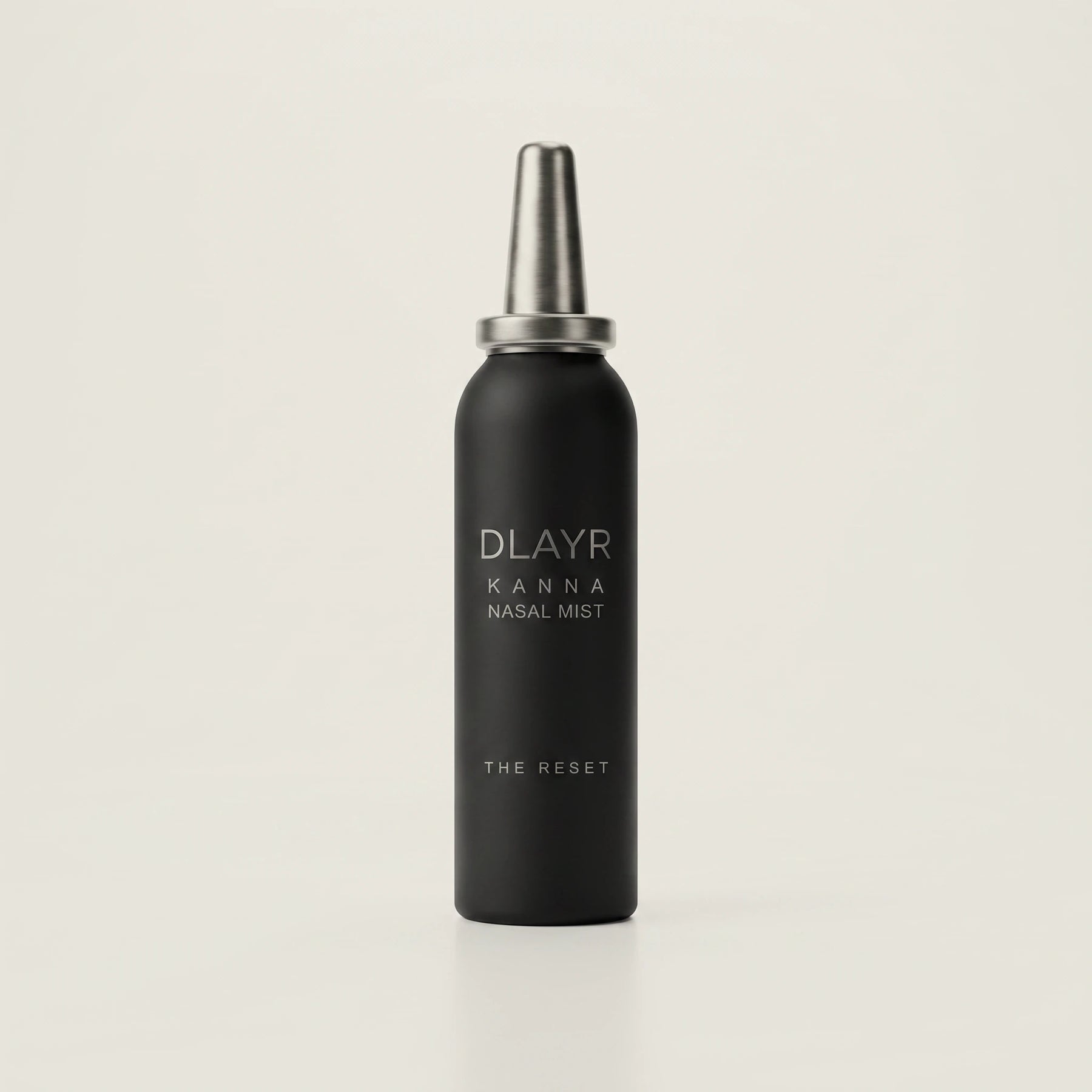 DLAYR kanna nasal mist bottle on a bone-white ground